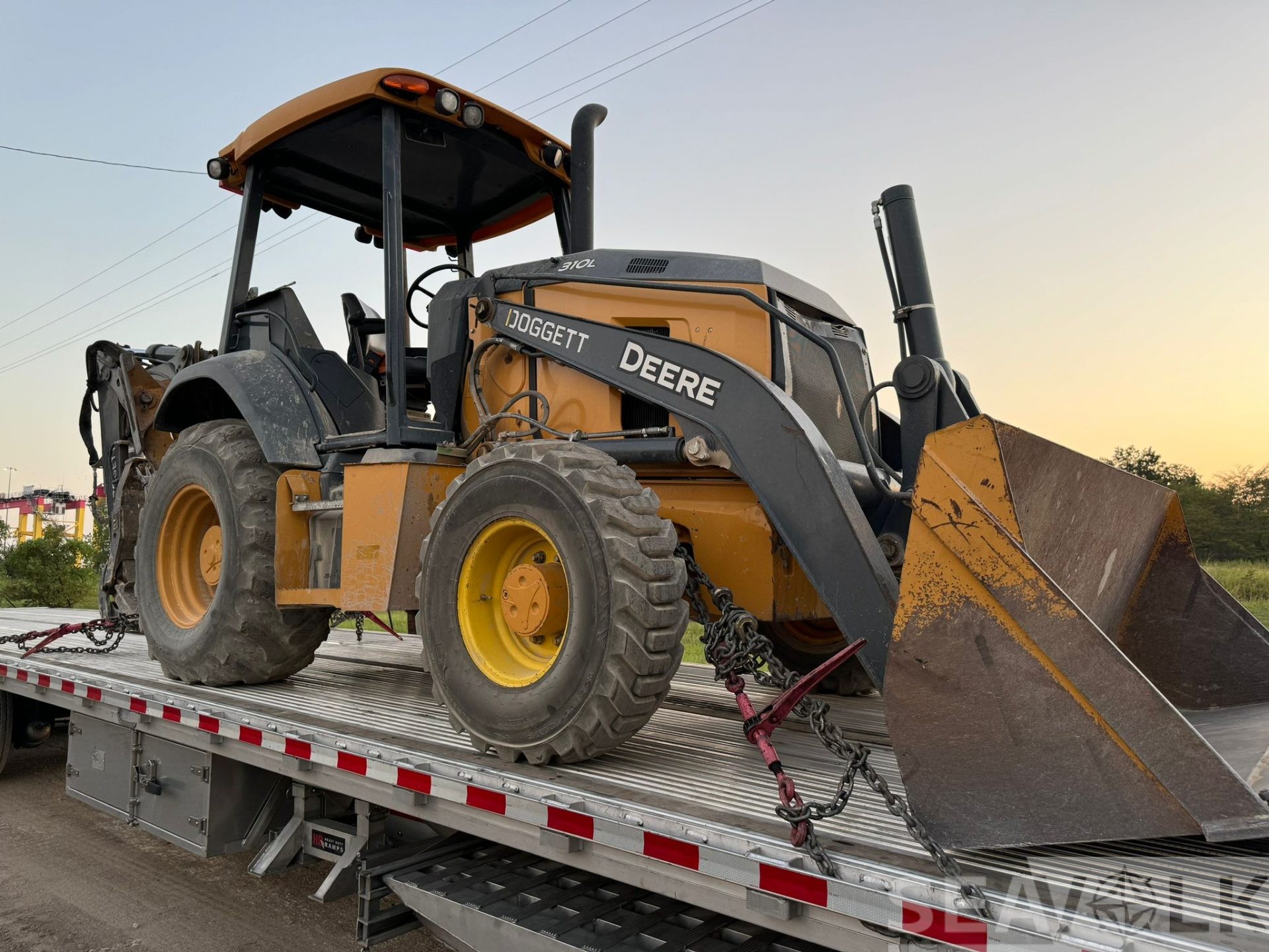 John Deere 310L Backhoe loaded for transport