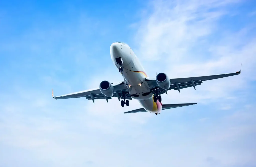 Cargo airplane taking off at sunrise, symbolizing fast and reliable air freight services.