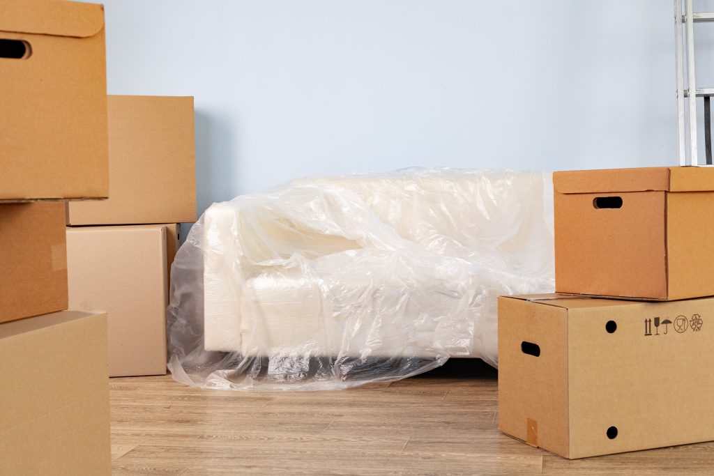 Workers packing boxes into a moving truck, illustrating smooth relocation and moving services.