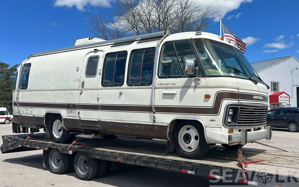 1978 Argosy 28 motorhome on a step-deck trailer — Michigan to Germany shipment