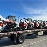 Bobcat T76 Loader Fleet — A line of Bobcat T76 loaders fills much of the equipment trailer.