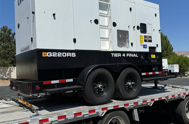 JCB G220RS Diesel Generator: An enclosed trailer-mounted generator with a towing chassis and protective body
