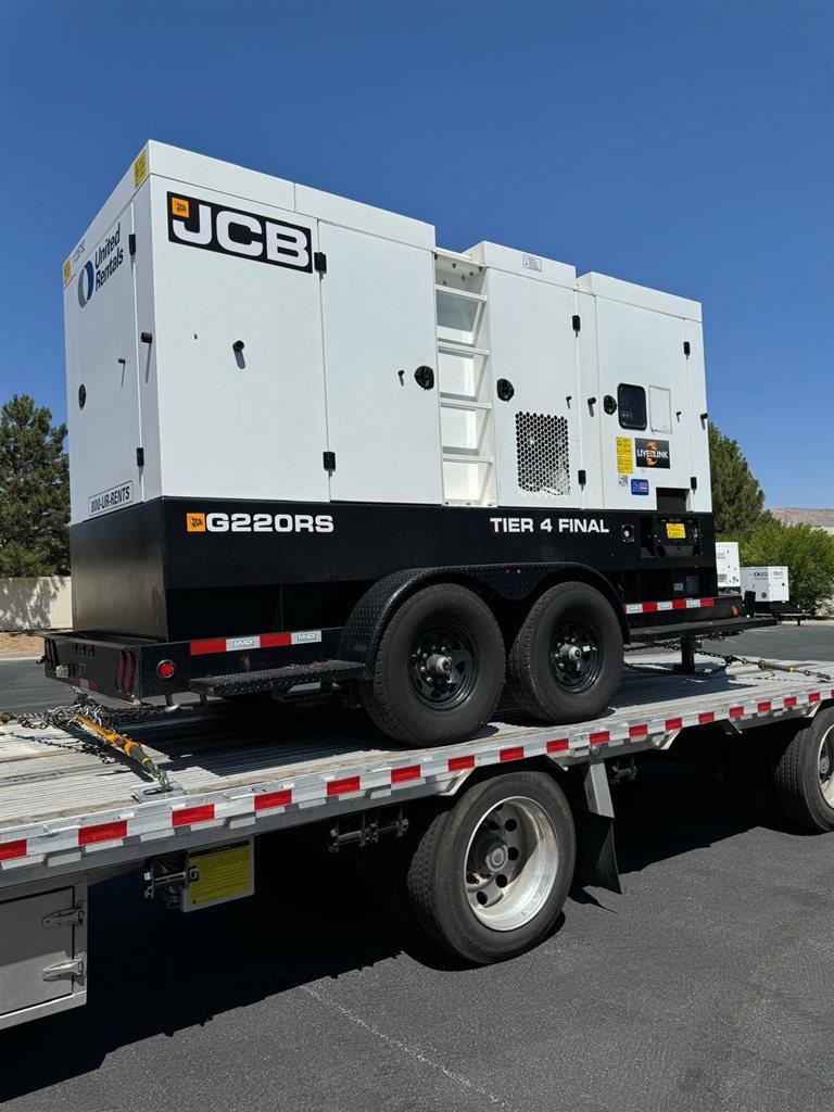 JCB G220RS Diesel Generator: An enclosed trailer-mounted generator with a towing chassis and protective body